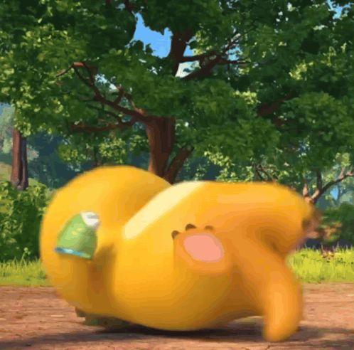 Yellow Stuffed Animal With Green Eyes Next To Child GIF