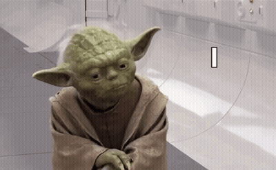 Yoda From Star Wars Is Standing In A Room With A White Wall . GIF
