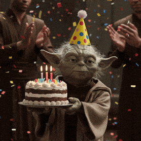Yoda Is Wearing A Party Hat And Holding A Cake With Candles GIF
