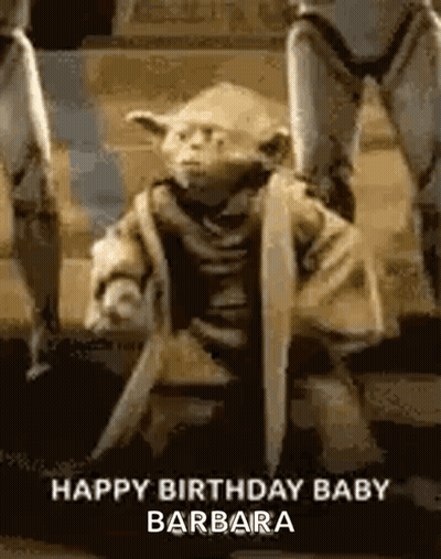Yoda Statue Holding Sword And Shield GIF