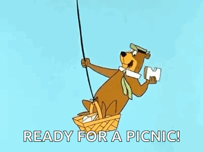 Yogi Bear Flying In Hot Air Balloon Holding Paper GIF