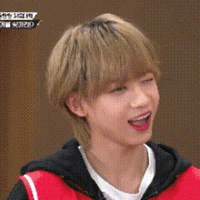 Young Blonde Man In Red Vest And Black Jacket GIF