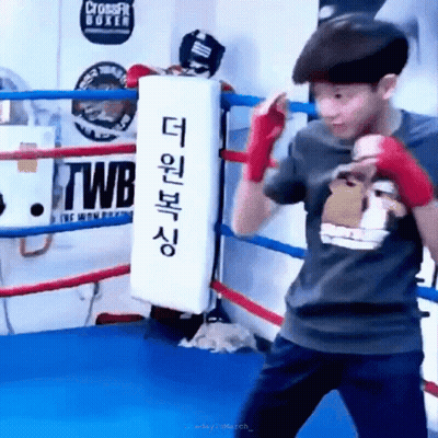 Young Boy Boxing In Ring With Twb Sign GIF