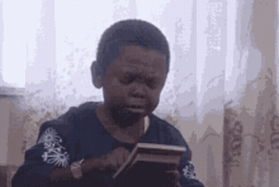 Young Boy Crying Holding Cell Phone GIF