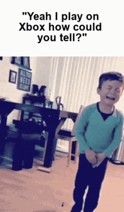 Young Boy Crying In Front Of All You Need Is Love Sign GIF