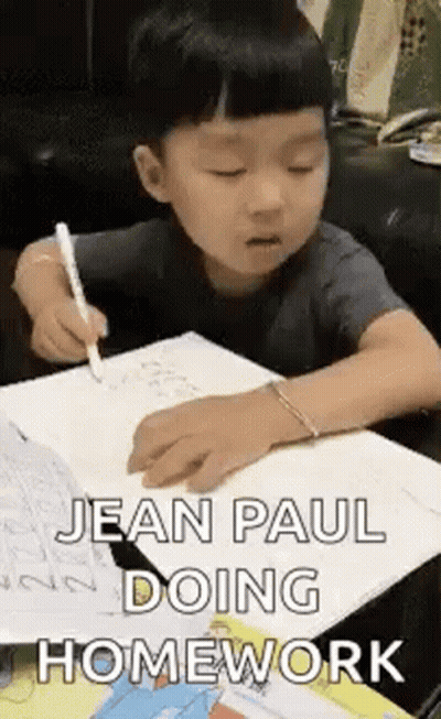 Young Boy Doing Homework With Pen GIF