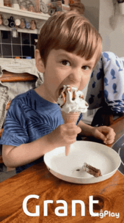 Young Boy Eating Ice Cream Cone With Grant GIF