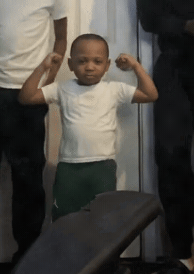 Young Boy Flexing Muscles Next To Man And Woman GIF