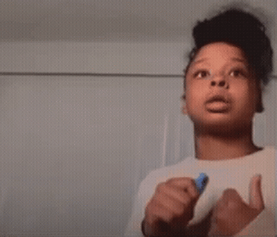 Young Boy Giving Thumbs Up Holding Blue Marker GIF