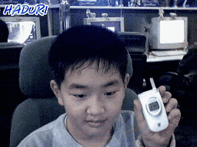Young Boy Holding Cell Phone With Haduri GIF