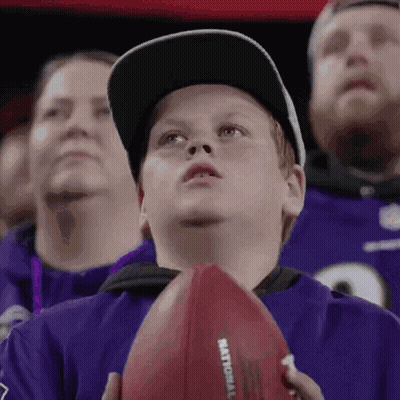 Young Boy Holding Football Saying National GIF