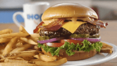 Young Boy Holding Hamburger With Army Bag GIF