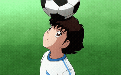 Young Boy Holding Soccer Ball On Head GIF
