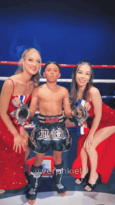 Young Boy Holding Trophy In Boxing Ring GIF
