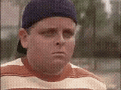 Young Boy In Baseball Cap Making Funny Face GIF