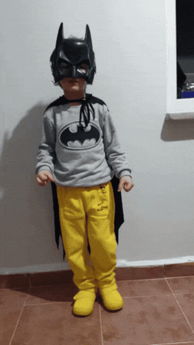 Young Boy In Batman Costume And Black Mask GIF