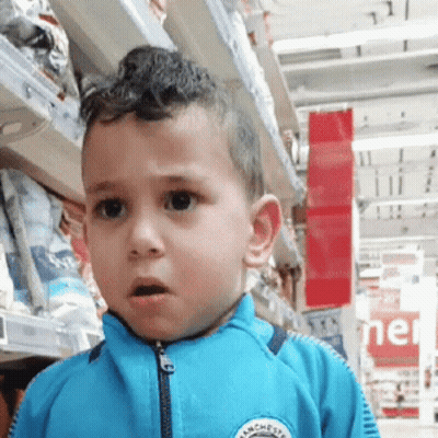 Young Boy In Blue Jacket With Manchester GIF
