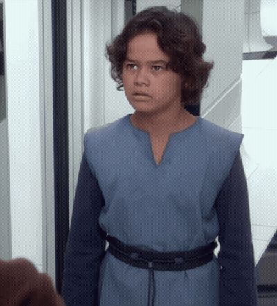 Young Boy In Blue Shirt And Black Belt GIF