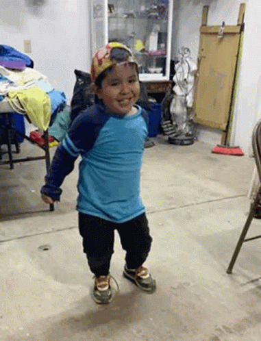 Young Boy In Blue Shirt And Hat Smiling GIF