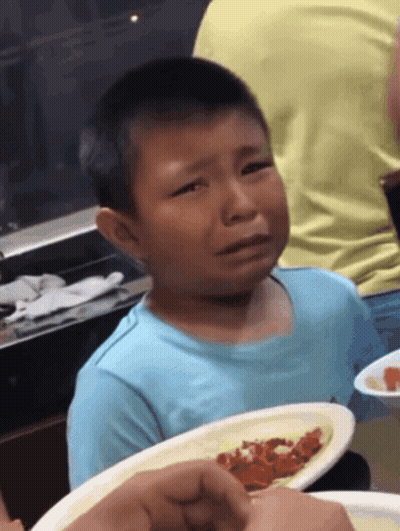 Young Boy In Blue Shirt Crying With Plate Of Food GIF