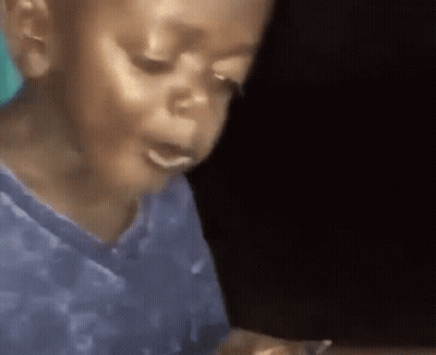 Young Boy In Blue Shirt Eating Food GIF