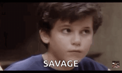 Young Boy In Blue Shirt Making Funny Face Saying Savage GIF