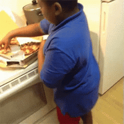 Young Boy In Blue Shirt Reaching For Pizza GIF