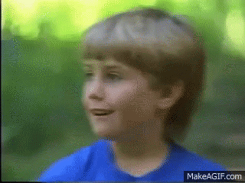 Young Boy In Blue Shirt Smiling GIF