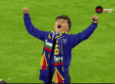 Young Boy In Blue Sweatshirt With Du Scarf GIF