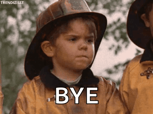 Young Boy In Fireman Helmet Saying Bye GIF