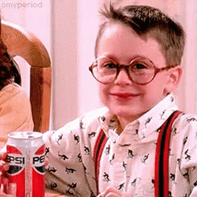 Young Boy In Glasses And Suspenders Holding Pepsi GIF