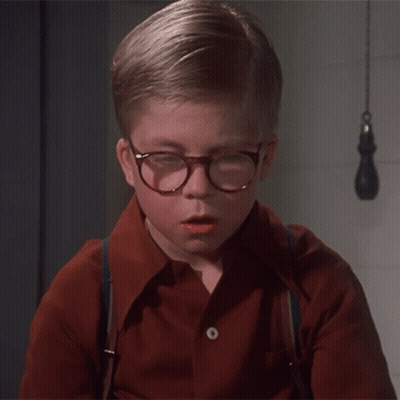 Young Boy In Glasses And Suspenders Looking Down GIF