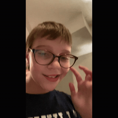 Young Boy In Glasses And T-Shirt Saying First GIF