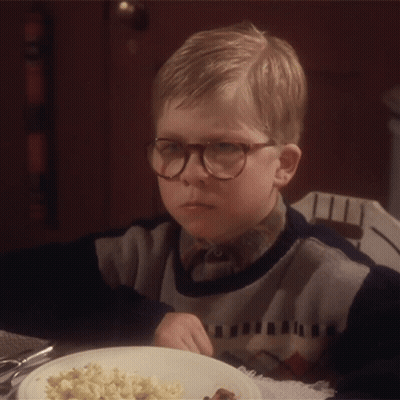 Young Boy In Glasses At Table With Food GIF