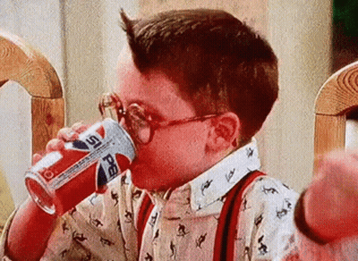 Young Boy In Glasses Drinking Pepsi Can GIF