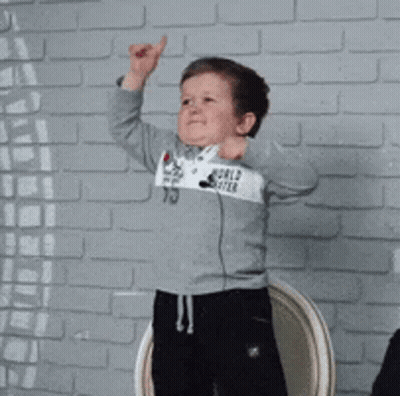 Young Boy In Gray Sweatshirt With World GIF