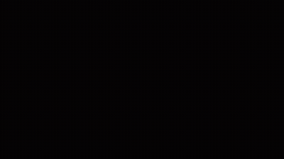 Young Boy In Green Shirt Sitting On Couch GIF