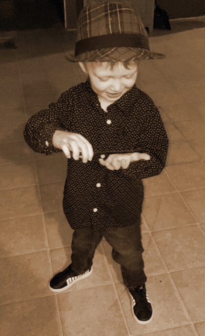 Young Boy In Hat And Polka Dot Shirt GIF
