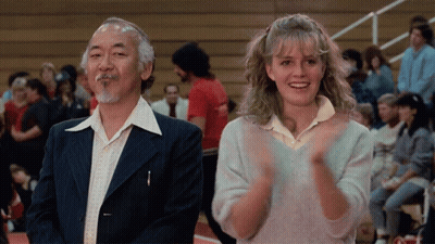 Young Boy In Karate Uniform Facing Crowd GIF