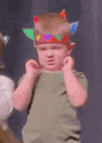 Young Boy In Native American Costume Making Funny Face GIF
