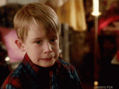 Young Boy In Plaid Shirt Making A Face GIF