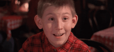 Young Boy In Plaid Shirt Smiling GIF
