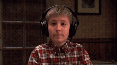 Young Boy In Plaid Shirt Wearing Headphones GIF