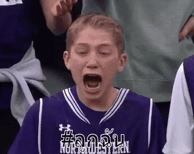 Young Boy In Purple Basketball Jersey Yawning In Crowd GIF