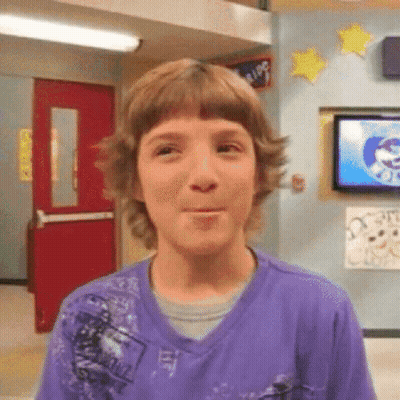 Young Boy In Purple Shirt Making Funny Face GIF