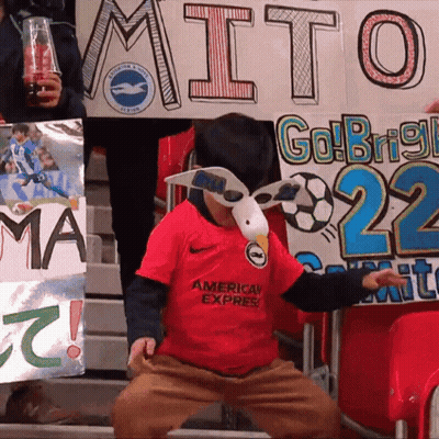 Young Boy In Red American Express Shirt In Crowd GIF