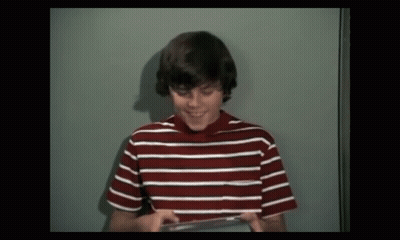 Young Boy In Red And White Striped Shirt Smiling GIF