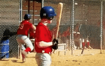 Young Boy In Red Jersey Holding Baseball Bat GIF