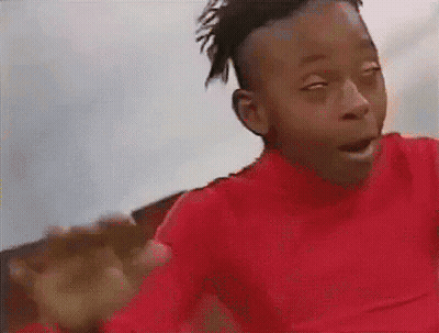 Young Boy In Red Shirt Making Funny Face GIF