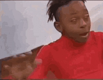 Young Boy In Red Shirt Making Funny Face GIF